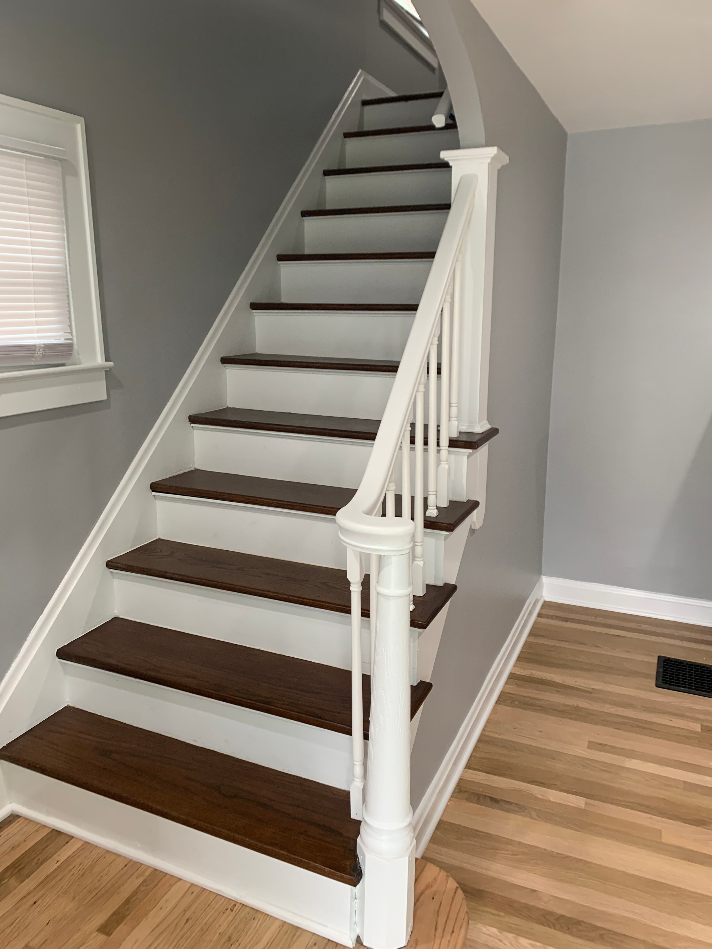 Professional painter rolling paint on wall at job site